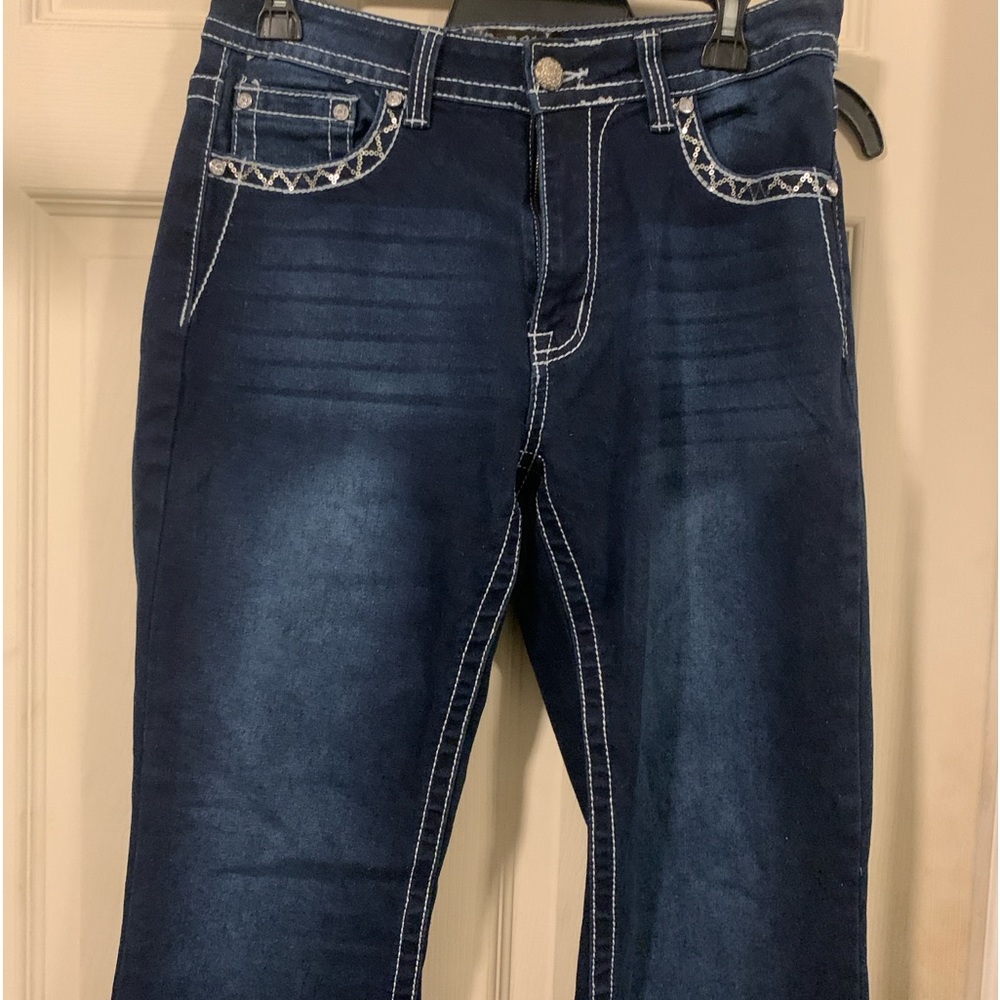 Dark wash rebel jeans with beading in the back